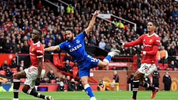 Everton's English striker Andros Townsend (C) scores his team's first goal during the English Premier League football match between Manchester United and Everton at Old Trafford in Manchester, north west England, on October 2, 2021. - RESTRICTED TO EDITORIAL USE. No use with unauthorized audio, video, data, fixture lists, club/league logos or 'live' services. Online in-match use limited to 120 images. An additional 40 images may be used in extra time. No video emulation. Social media in-match use limited to 120 images. An additional 40 images may be used in extra time. No use in betting publications, games or single club/league/player publications. (Photo by Oli SCARFF / AFP) / RESTRICTED TO EDITORIAL USE. No use with unauthorized audio, video, data, fixture lists, club/league logos or 'live' services. Online in-match use limited to 120 images. An additional 40 images may be used in extra time. No video emulation. Social media in-match use limited to 120 images. An additional 40 images may be used in extra time. No use in betting publications, games or single club/league/player publications. / RESTRICTED TO EDITORIAL USE. No use with unauthorized audio, video, data, fixture lists, club/league logos or 'live' services. Online in-match use limited to 120 images. An additional 40 images may be used in extra time. No video emulation. Social media in-match use limited to 120 images. An additional 40 images may be used in extra time. No use in betting publications, games or single club/league/player publications. (Photo by OLI SCARFF/AFP via Getty Images)