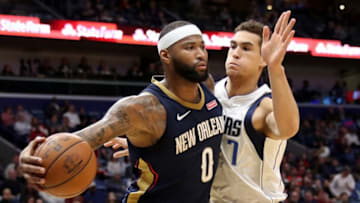 NEW ORLEANS, LA - DECEMBER 29: DeMarcus Cousins #0 of the New Orleans Pelicans passes the ball around Dwight Powell #7 of the Dallas Mavericks at Smoothie King Center on December 29, 2017 in New Orleans, Louisiana. (Photo by Chris Graythen/Getty Images)