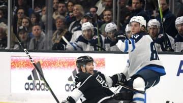 LOS ANGELES, CALIFORNIA - MARCH 18: Sami Niku #83 of the Winnipeg Jets takes an interference penalty on Brendan Leipsic #14 of the Los Angeles Kings during the second period at Staples Center on March 18, 2019 in Los Angeles, California. (Photo by Harry How/Getty Images)