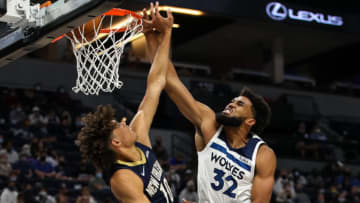 MINNEAPOLIS, MN - OCTOBER 4: Karl-Anthony Towns #32 of the Minnesota Timberwolves dunks the ball over Jaxson Hayes #10 of the New Orleans Pelicans in the second quarter of a preseason game at Target Center on October 4, 2021 in Minneapolis, Minnesota. NOTE TO USER: User expressly acknowledges and agrees that, by downloading and or using this Photograph, user is consenting to the terms and conditions of the Getty Images License Agreement. (Photo by David Berding/Getty Images)