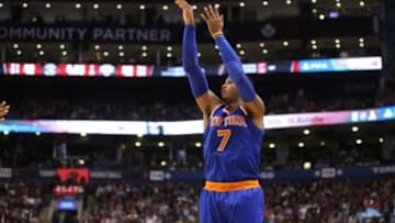 Nov 10, 2015; Toronto, Ontario, CAN; New York Knicks forward Carmelo Anthony (7) hits a three-point shot against the Toronto Raptors at Air Canada Centre. The Knicks beat the Raptors 111-109. Mandatory Credit: Tom Szczerbowski-USA TODAY Sports
