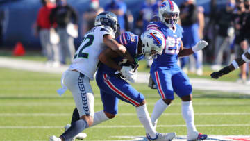 ORCHARD PARK, NEW YORK - NOVEMBER 08: Quinton Dunbar #22 of the Seattle Seahawks tackles Gabriel Davis #13 of the Buffalo Bills during the first half at Bills Stadium on November 08, 2020 in Orchard Park, New York. (Photo by Timothy T Ludwig/Getty Images)