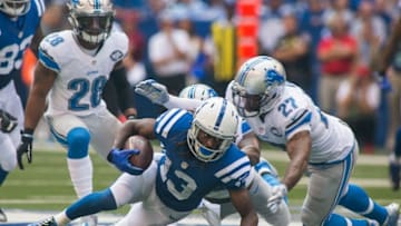 Sep 11, 2016; Indianapolis, IN, USA; Indianapolis Colts wide receiver T.Y. Hilton (13) dives for more yardage while being tackled by Detroit Lions free safety Glover Quin (27) in the first quarter of the game at Lucas Oil Stadium. Mandatory Credit: Trevor Ruszkowski-USA TODAY Sports