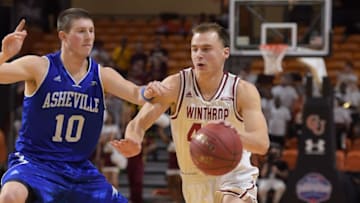 BUIES CREEK, NC - MARCH 06: Jimmy Gavin #44 of the Winthrop Eagles moves the ball against Kevin Vannatta #10 of the North Carolina-Asheville Bulldogs during the championship game of the 2016 Big South Basketball Tournament at Pope Convocation Center on March 6, 2016 in Buies Creek, North Carolina. UNC Asheville defeated Winthrop 77-68. (Photo by Lance King/Getty Images)