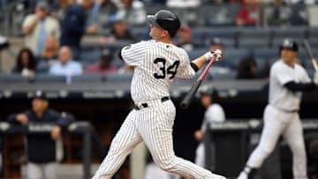 Oct 2, 2016; Bronx, NY, USA; New York Yankees catcher Brian McCann (34) hits a home run in the bottom of the fourth inning against the Baltimore Orioles at Yankee Stadium. It was the 20th home run of the season for McCann. Mandatory Credit: Danny Wild-USA TODAY Sports