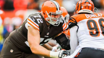 Dec 14, 2014; Cleveland, OH, USA; Cleveland Browns tackle Mitchell Schwartz (72) and Cincinnati Bengals defensive end Carlos Dunlap (96) at FirstEnergy Stadium. Mandatory Credit: Ken Blaze-USA TODAY Sports