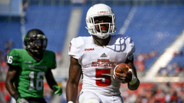 BOCA RATON, FL - DECEMBER 02: Devin Singletary #5 of the Florida Atlantic Owls rushes for a touchdown past Kemon Hall #16 of the North Texas Mean Green during the Conference USA Championship game at FAU Stadium on December 2, 2017 in Boca Raton, Florida. (Photo by Rob Foldy/Getty Images)