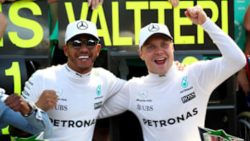 MONZA, ITALY - SEPTEMBER 03: Race winner Lewis Hamilton of Great Britain and Mercedes GP celebrates with second place Valtteri Bottas of Finland and Mercedes GP after` the Formula One Grand Prix of Italy at Autodromo di Monza on September 3, 2017 in Monza, Italy. (Photo by Dan Istitene/Getty Images)