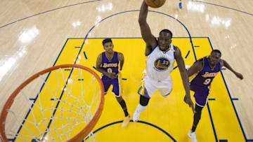 November 23, 2016; Oakland, CA, USA; Golden State Warriors forward Draymond Green (23) dunks the basketball against Los Angeles Lakers guard Nick Young (0) and forward Luol Deng (9) during the first half at Oracle Arena. The Warriors defeated the Lakers 149-106. Mandatory Credit: Kyle Terada-USA TODAY Sports