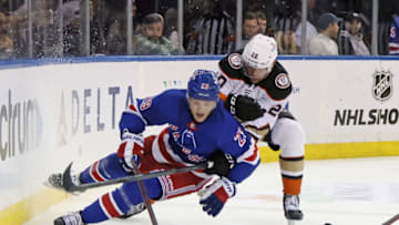 NEW YORK, NEW YORK - OCTOBER 17: Brett Leason #20 of the Anaheim Ducks trips up Dryden Hunt #29 of the New York Rangers during the first period at Madison Square Garden on October 17, 2022 in New York City. (Photo by Bruce Bennett/Getty Images)