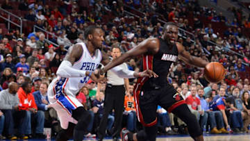 PHILADELPHIA - MARCH 04: Luol Deng #9 of the Miami Heat handles the ball against Robert Covington #33 of the Philadelphia 76ers at the Wells Fargo Center on March 4, 2016 in Philadelphia, Pennsylvania. NOTE TO USER: User expressly acknowledges and agrees that, by downloading and or using this photograph, User is consenting to the terms and conditions of the Getty Images License Agreement. Mandatory Copyright Notice: Copyright 2016 NBAE (Photo by David Dow/NBAE via Getty Images)
