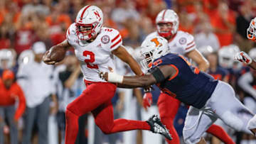 CHAMPAIGN, IL - SEPTEMBER 21: Adrian Martinez #2 of the Nebraska Cornhuskers runs the ball as Jamal Milan #55 of the Illinois Fighting Illini tries to make the stop during the second half at Memorial Stadium on September 21, 2019 in Champaign, Illinois. (Photo by Michael Hickey/Getty Images)
