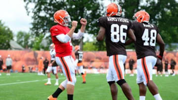 Jul 28, 2014; Berea, OH, USA; Cleveland Browns quarterback Johnny Manziel (2) celebrates with Anthony Armstrong (86) and Ray Agnew (48) after a touchdown during training camp at Cleveland Browns training facility. Mandatory Credit: Andrew Weber-USA TODAY Sports