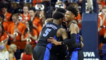 CHARLOTTESVILLE, VA - FEBRUARY 09: Cam Reddish #2, RJ Barrett #5 and Zion Williamson #1 of the Duke Blue Devils hug in the second half during a game against the Virginia Cavaliers at John Paul Jones Arena on February 9, 2019 in Charlottesville, Virginia. (Photo by Ryan M. Kelly/Getty Images)