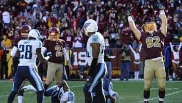 Oct 19, 2014; Landover, MD, USA; Washington Redskins kicker Kai Forbath (2) and Washington Redskins tight end Logan Paulsen (82) celebrate after kicking the game winning field goal as time expired against the Tennessee Titans during the second half at FedEx Field. Mandatory Credit: Brad Mills-USA TODAY Sports