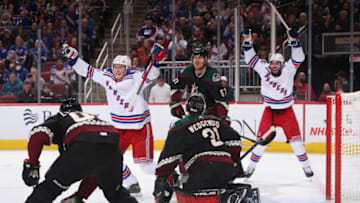 GLENDALE, ARIZONA - DECEMBER 15: Kaapo Kakko #24 and Mika Zibanejad #93 of the New York Rangers celebrate after Kakko scored a power-play goal past goaltender Scott Wedgewood #31 of the Arizona Coyotes during the third period of the NHL game at Gila River Arena on December 15, 2021 in Glendale, Arizona. The Rangers defeated the Coyotes 3-2. (Photo by Christian Petersen/Getty Images)