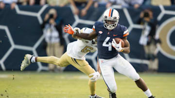 ATLANTA, GA - NOVEMBER 17: Wide receiver Olamide Zaccheaus #4 of the Virginia Cavaliers runs the ball past defensive back Lamont Simmons #6 of the Georgia Tech Yellow Jackets during the forth quarter at Bobby Dodd Stadium on November 17, 2018 in Atlanta, Georgia. (Photo by Michael Chang/Getty Images)