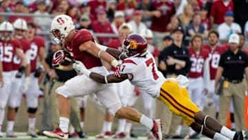 Sep 17, 2016; Stanford, CA, USA; Stanford Cardinal running back Christian McCaffrey (5) rushes against USC Trojans defensive back Marvell Tell III (7) during the first half of a NCAA football game at Stanford Stadium. Mandatory Credit: Kirby Lee-USA TODAY Sports