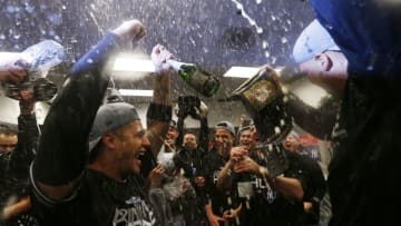 MINNEAPOLIS, MINNESOTA - OCTOBER 07: Gleyber Torres #25 of the New York Yankees celebrates with teammates in the locker room after sweeping the Minnesota Twins 3-0 in the American League Division Series to advance to the American League Championship Series at Target Field on October 07, 2019 in Minneapolis, Minnesota. (Photo by Elsa/Getty Images)