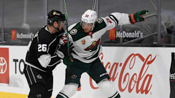Minnesota's Kevin Fiala, right, fends off Sean Walker during a matchup in Los Angeles last season. The Wild will open this year on the West Coast again, which means late faceoff times..(Photo by Harry How/Getty Images)