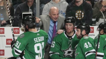 DALLAS, TX - NOVEMBER 16: Jim Montgomery of the Dallas Stars gives instructions to his players on the bench against the Boston Bruins at the American Airlines Center on November 16, 2018 in Dallas, Texas. (Photo by Glenn James/NHLI via Getty Images)