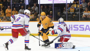 NASHVILLE, TN - NOVEMBER 02: New York Rangers defenseman Jacob Trouba (8) defends as Nashville Predators center Matt Duchene (95) deflects the puck off the pads of goalie Alexandar Georgiev (40) during the NHL game between the Nashville Predators and New York Rangers, held on November 2, 2019, at Bridgestone Arena in Nashville, Tennessee. (Photo by Danny Murphy/Icon Sportswire via Getty Images)
