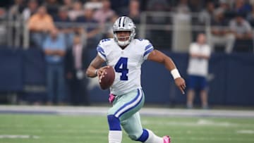 Oct 9, 2016; Arlington, TX, USA; Dallas Cowboys quarterback Dak Prescott (4) scrambles with the ball in the first quarter against Cincinnati Bengals at AT&T Stadium. Mandatory Credit: Matthew Emmons-USA TODAY Sports