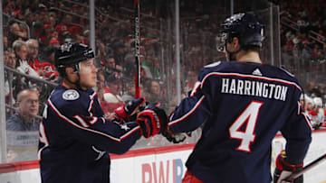 NEWARK, NEW JERSEY - DECEMBER 23: Cam Atkinson #13 of the Columbus Blue Jackets celebrates his goal against the New Jersey Devils at 4:13 of the first period and is joined by Scott Harrington #4 at the Prudential Center on December 23, 2018 in Newark, New Jersey. (Photo by Bruce Bennett/Getty Images)