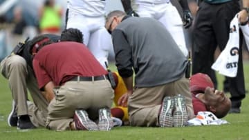 Sep 21, 2014; Philadelphia, PA, USA; Washington Redskins cornerback DeAngelo Hall (23) lies on the field as medical personnel check on him during game against the Philadelphia Eagles at Lincoln Financial Field. The Eagles defeated the Redskins, 37-34. Mandatory Credit: Eric Hartline-USA TODAY Sports