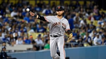 Jun 19, 2015; Los Angeles, CA, USA; San Francisco Giants shortstop Brandon Crawford (35) throws to first base for the out against the Los Angeles Dodgers during the ninth inning at Dodger Stadium. Mandatory Credit: Richard Mackson-USA TODAY Sports