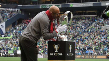 SEATTLE, WA - NOVEMBER 10: Toronto FC legend Danny Dichio kisses the Philip F. Anschutz Trophy after helping to take it onto the field during a game between Toronto FC and Seattle Sounders FC at CenturyLink Field on November 10, 2019 in Seattle, Washington. (Photo by Andy Mead/ISI Photos/Getty Images)