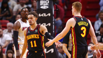 MIAMI, FLORIDA - APRIL 08: Trae Young #11 and Kevin Huerter #3 of the Atlanta Hawks celebrate against the Miami Heat during the second half at FTX Arena on April 08, 2022 in Miami, Florida. NOTE TO USER: User expressly acknowledges and agrees that, by downloading and or using this photograph, User is consenting to the terms and conditions of the Getty Images License Agreement. (Photo by Michael Reaves/Getty Images)