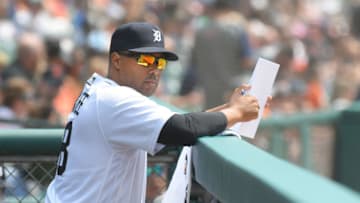 DETROIT, MI - AUGUST 01: First base coach Kimera Bartee #18 of the Detroit Tigers looks on from the dugout during the game against the Baltimore Orioles at Comerica Park on August 1, 2021 in Detroit, Michigan. The Tigers defeated the Orioles 6-2. (Photo by Mark Cunningham/MLB Photos via Getty Images)