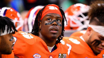 NEW ORLEANS, LA - JANUARY 13: Travis Etienne #9 of the Clemson Tigers looks at the scoreboard against the LSU Tigers during the College Football Playoff National Championship held at the Mercedes-Benz Superdome on January 13, 2020 in New Orleans, Louisiana. (Photo by Jamie Schwaberow/Getty Images)