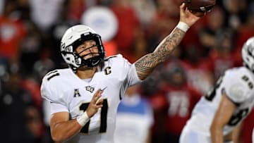 Sep 17, 2021; Louisville, Kentucky, USA; UCF Knights quarterback Dillon Gabriel (11) throws a pass against the Louisville Cardinals during the second half at Cardinal Stadium. Louisville defeated Central Florida 42-35. Mandatory Credit: Jamie Rhodes-USA TODAY Sports
