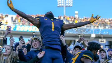 MORGANTOWN, WV - NOVEMBER 10: West Virginia Mountaineers wide receiver T.J. Simmons (1) celebrates in the stands with fans following the college football game between the TCU Horned Frogs and the West Virginia Mountaineers on November 10, 2018, at Mountaineer Field at Milan Puskar Stadium in Morgantown, WV. (Photo by Frank Jansky/Icon Sportswire via Getty Images)
