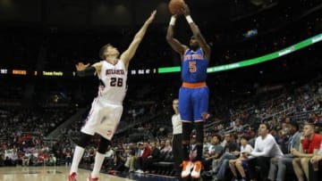 Apr 13, 2015; Atlanta, GA, USA; New York Knicks guard Tim Hardaway Jr. (5) shoots over Atlanta Hawks guard Kyle Korver (26) in the first quarter at Philips Arena. Mandatory Credit: Brett Davis-USA TODAY Sports