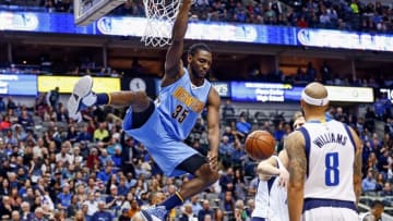 Feb 26, 2016; Dallas, TX, USA; Denver Nuggets forward Kenneth Faried (35) dunks as Dallas Mavericks guard Deron Williams (8) looks on during the game at American Airlines Center. Mandatory Credit: Kevin Jairaj-USA TODAY Sports