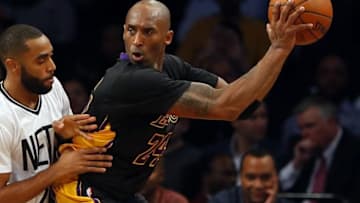 Nov 6, 2015; Brooklyn, NY, USA; Brooklyn Nets guard Wayne Ellington (21) defends against Los Angeles Lakers forward Kobe Bryant (24) during first half at Barclays Center. Mandatory Credit: Noah K. Murray-USA TODAY Sports