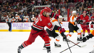 Nov 21, 2019; Raleigh, NC, USA; Carolina Hurricanes defenseman Dougie Hamilton (19) shoots against the Philadelphia Flyers at PNC Arena. The Flyers won 5-2. Mandatory Credit: James Guillory-USA TODAY Sports