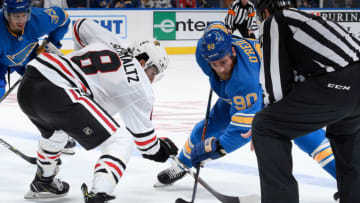 ST. LOUIS, MO - OCTOBER 6: Nick Schmaltz #8 of the Chicago Blackhawks and Ryan O'Reilly #90 of the St. Louis Blues face-off at Enterprise Center on October 6, 2018 in St. Louis, Missouri. (Photo by Scott Rovak/NHLI via Getty Images)