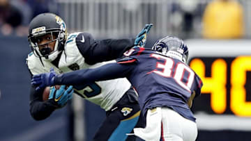 Jan 3, 2016; Houston, TX, USA;Jacksonville Jaguars wide receiver Allen Robinson (15) runs with the ball as Houston Texans strong safety Kevin Johnson (30) defends during the first quarter at NRG Stadium. Mandatory Credit: Kevin Jairaj-USA TODAY Sports