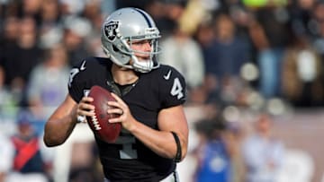 OAKLAND, CA - DECEMBER 4: Quarterback Derek Carr #4 of the Oakland Raiders looks to throw against the Buffalo Bills in the third quarter on December 4, 2016 at Oakland-Alameda County Coliseum in Oakland, California. The Raiders won 38-24. (Photo by Brian Bahr/Getty Images)