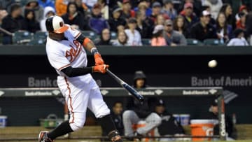 Apr 28, 2016; Baltimore, MD, USA; Baltimore Orioles center fielder Adam Jones (10) hits an RBI double during the first inning against the Chicago White Sox at Oriole Park at Camden Yards. Mandatory Credit: Tommy Gilligan-USA TODAY Sports