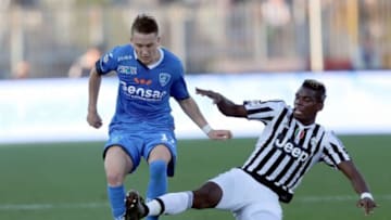 EMPOLI, ITALY - NOVEMBER 08: Piotr Zielinski of Empoli FC battles for the ball with Paul Pogba of Juventus FC during the Serie A match between Empoli FC and Juventus FC at Stadio Carlo Castellani on November 8, 2015 in Empoli, Italy. (Photo by Gabriele Maltinti/Getty Images)