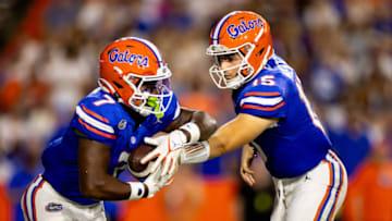 Sep 9, 2023; Gainesville, Florida, USA; Florida Gators quarterback Graham Mertz (15) hands the ball to Florida Gators running back Trevor Etienne (7) during the second half against the McNeese State Cowboys at Ben Hill Griffin Stadium. Mandatory Credit: Matt Pendleton-USA TODAY Sports
