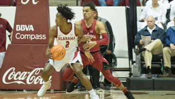 TUSCALOOSA, AL - JANUARY 27: Collin Sexton #2 of the Alabama Crimson Tide looks to maneuver by Trae Young #11 of the Oklahoma Sooners during the game at Coleman Coliseum on January 27, 2018 in Tuscaloosa, Alabama. (Photo by Michael Chang/Getty Images)