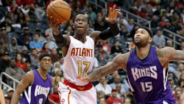 Nov 18, 2015; Atlanta, GA, USA; Atlanta Hawks guard Dennis Schroder (17) attempts a shot against Sacramento Kings forward DeMarcus Cousins (15) in the fourth quarter of their game at Philips Arena. The Hawks won 103-97. Mandatory Credit: Jason Getz-USA TODAY Sports
