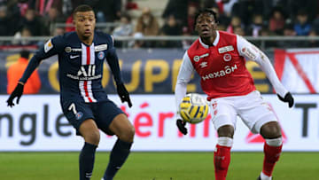 Reims' French defender Axel Disasi (R) and Paris Saint-Germain's French forward Kylian Mbappe vie for the ball during the French League Cup semi-final football match between Stade de Reims and Paris Saint-Germain at the Auguste Delaune Stadium in Reims on January 22, 2020. (Photo by FRANCOIS NASCIMBENI / AFP) (Photo by FRANCOIS NASCIMBENI/AFP via Getty Images)