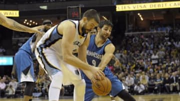 Oct 29, 2014; Memphis, TN, USA; Memphis Grizzlies center Marc Gasol (33) and Minnesota Timberwolves guard Ricky Rubio (9) fight for the ball during the game at FedExForum. Memphis Grizzlies beat the Minnesota Timberwolves 105 -101. Mandatory Credit: Justin Ford-USA TODAY Sports